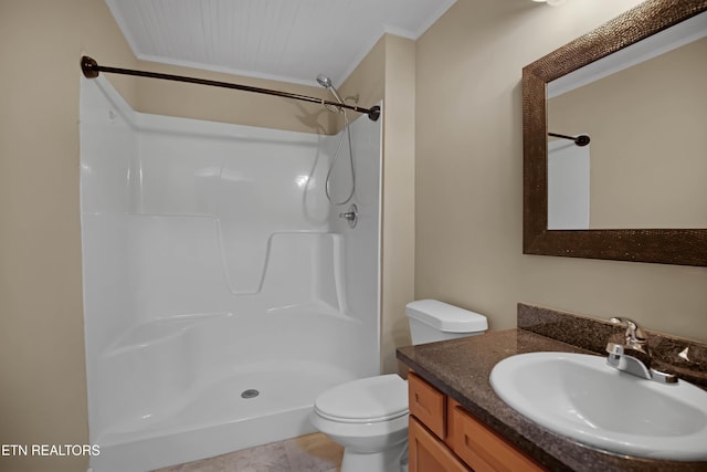 bathroom featuring toilet, walk in shower, crown molding, and vanity