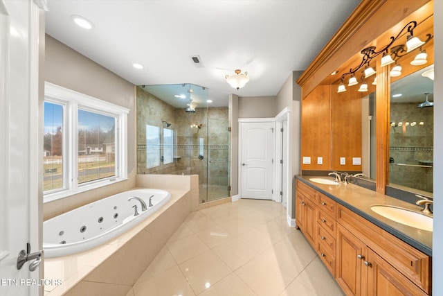 bathroom with a whirlpool tub, a shower stall, double vanity, and a sink