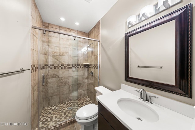 full bath featuring recessed lighting, a shower stall, toilet, and vanity