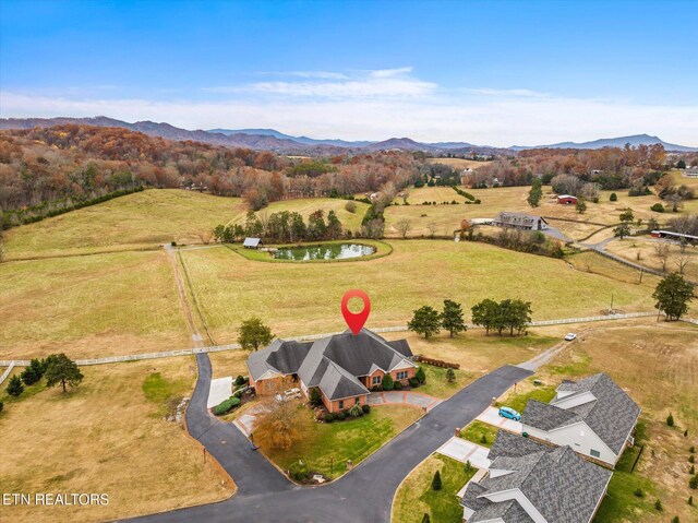 aerial view with a rural view and a water and mountain view