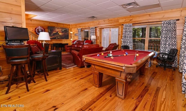 recreation room with billiards, wooden walls, visible vents, a drop ceiling, and light wood-style floors