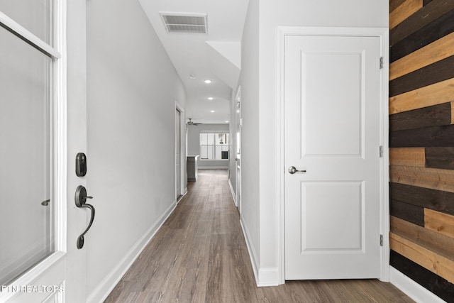 corridor with recessed lighting, wood finished floors, visible vents, and baseboards