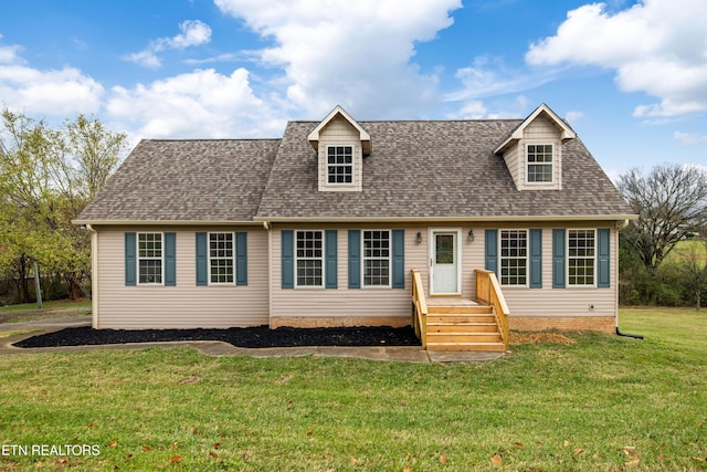 cape cod home with a front lawn and roof with shingles