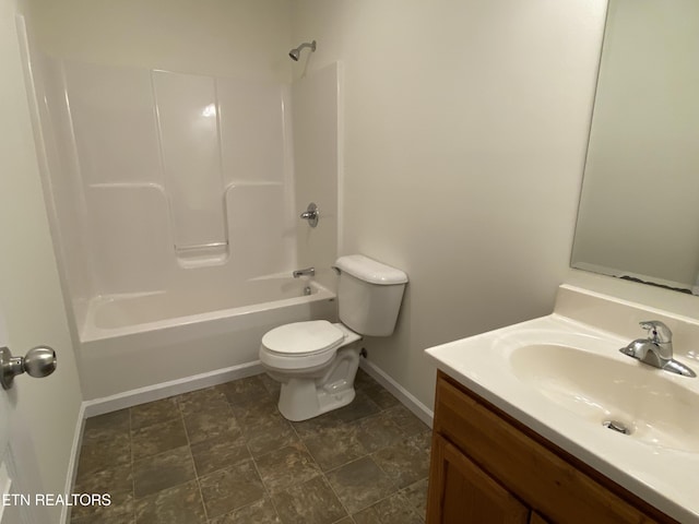 bathroom with toilet, vanity, baseboards, and shower / bathing tub combination