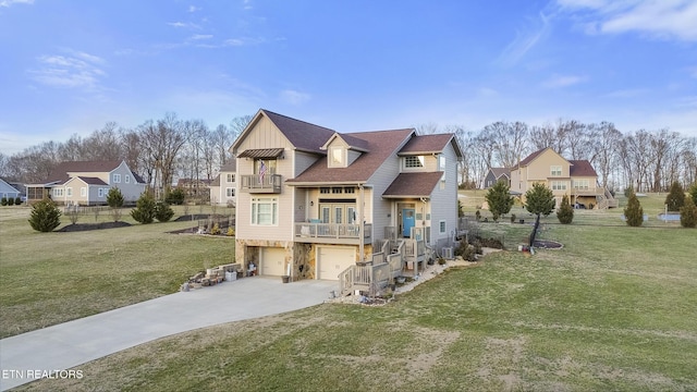 view of front facade with an attached garage, a balcony, concrete driveway, a residential view, and a front lawn