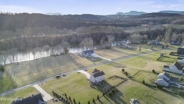 aerial view featuring a forest view, a mountain view, and a rural view