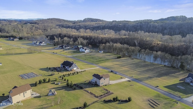 drone / aerial view with a rural view and a forest view