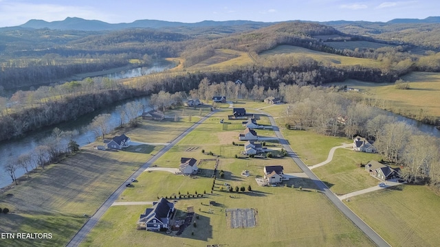 drone / aerial view featuring a rural view and a mountain view