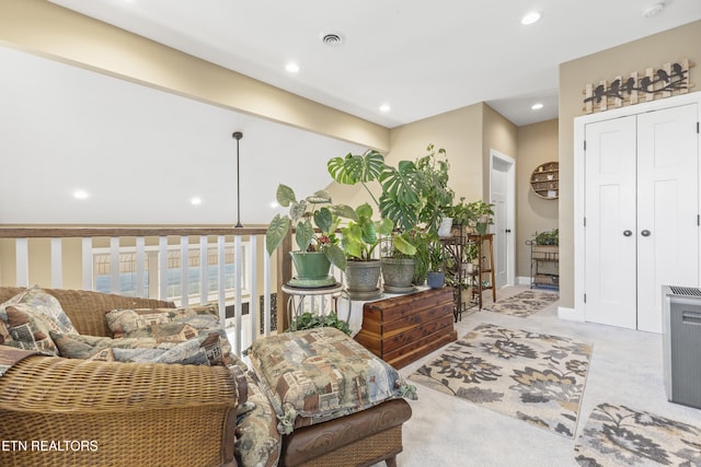 sitting room featuring baseboards, visible vents, and recessed lighting