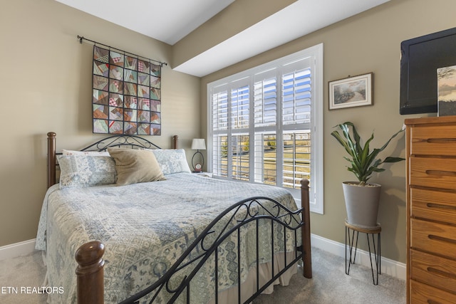 carpeted bedroom with baseboards