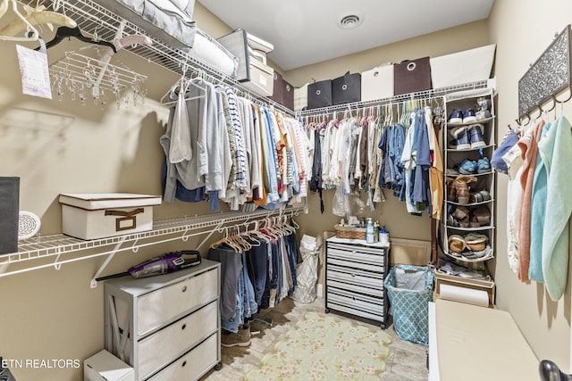 spacious closet featuring visible vents