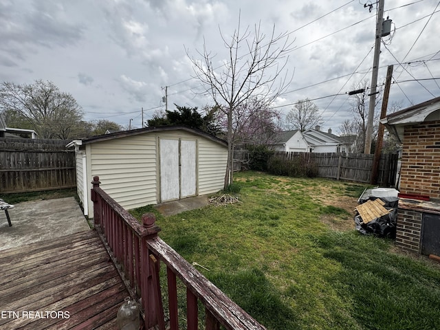 1640 Lodge St, Alcoa, TN 37701 - view of yard featuring a wooden deck, an outbuilding, a fenced backyard, and a shed