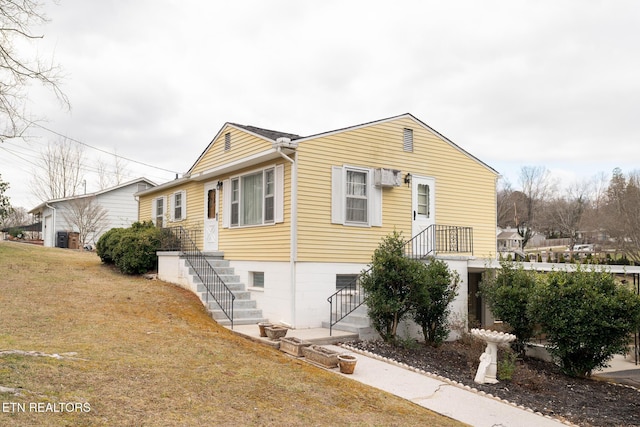 view of property exterior with a lawn