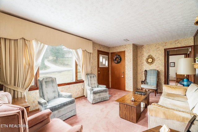 living room featuring light colored carpet, a textured ceiling, and wallpapered walls