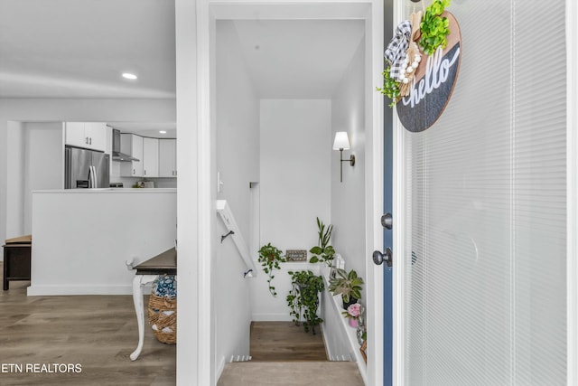 interior space with light wood-style floors, baseboards, and recessed lighting