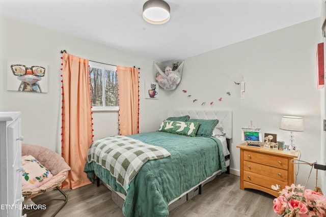 bedroom featuring wood finished floors