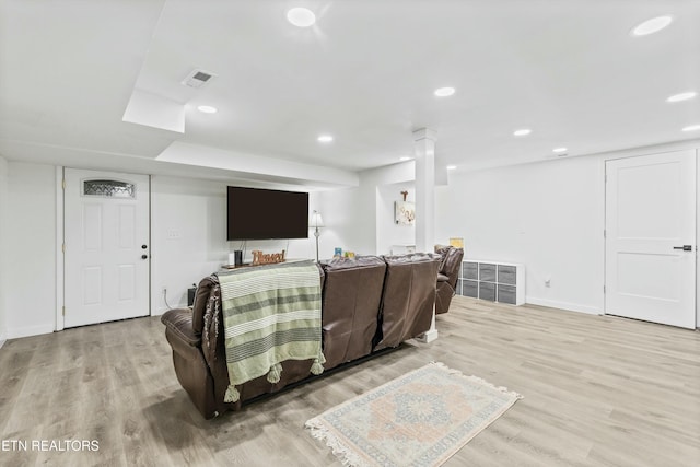 living room featuring visible vents, wood finished floors, and recessed lighting