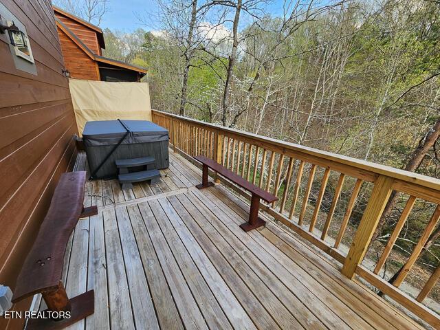 1012 Ravens Ford Way, Sevierville, TN 37876 - wooden terrace featuring a hot tub and area for grilling