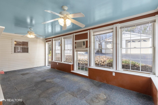 unfurnished sunroom with cooling unit and a healthy amount of sunlight