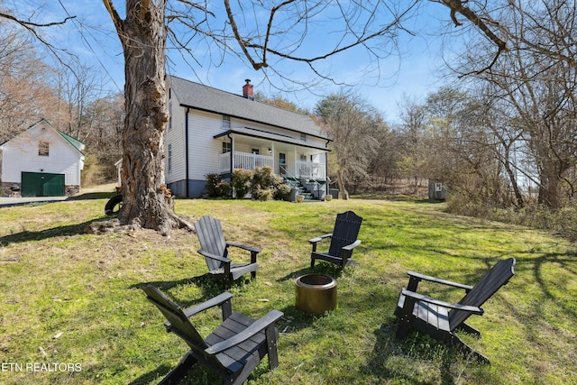 view of yard with covered porch