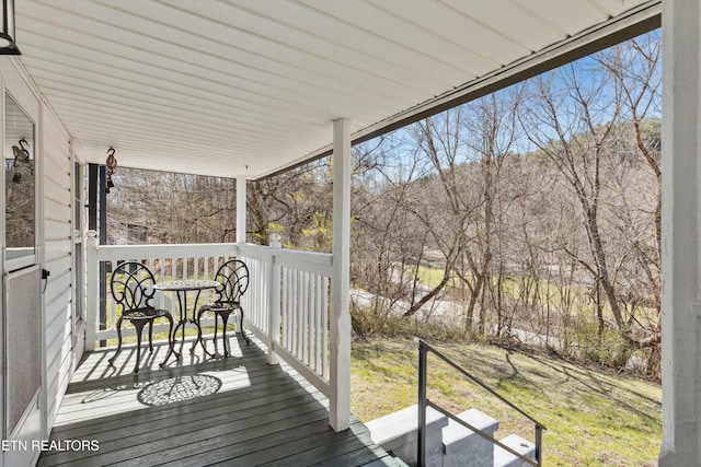 wooden terrace featuring a porch