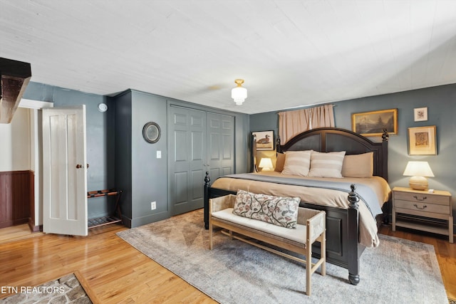 bedroom featuring a closet and light wood-style floors