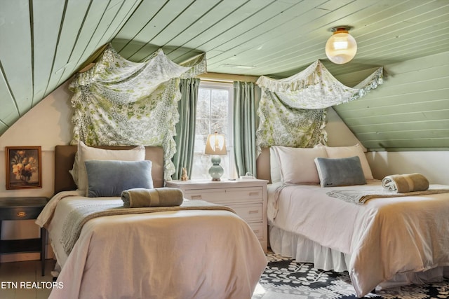 bedroom featuring lofted ceiling and wooden ceiling