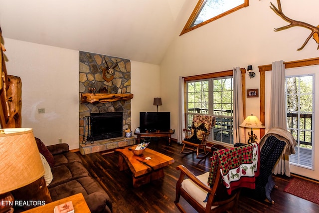 living area with a fireplace, high vaulted ceiling, and wood finished floors