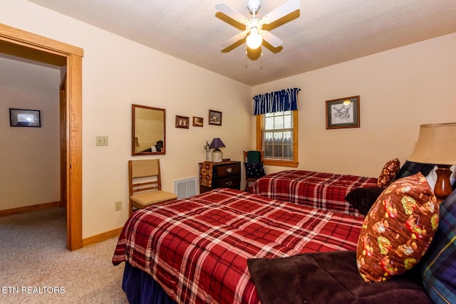 bedroom with baseboards, visible vents, ceiling fan, and carpet flooring