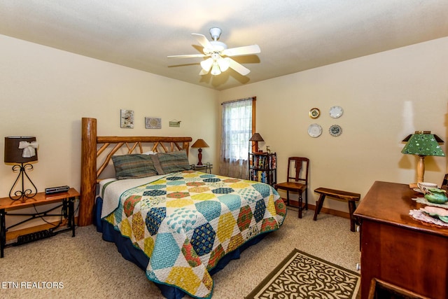 bedroom with a ceiling fan, baseboards, and carpet flooring