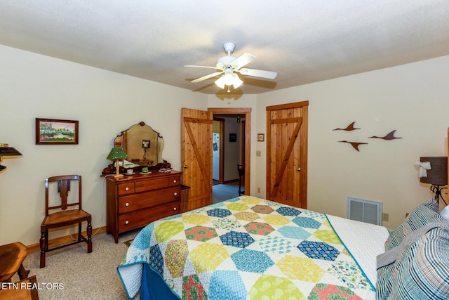 bedroom with ceiling fan, visible vents, baseboards, a closet, and carpet