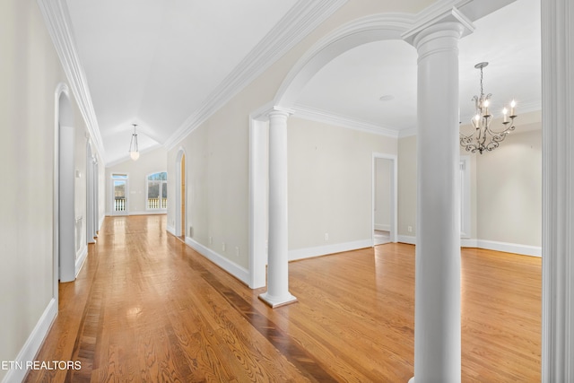 corridor with ornate columns, arched walkways, and ornamental molding