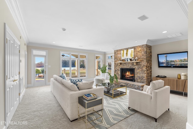 living area with ornamental molding, a fireplace, visible vents, and light colored carpet