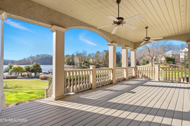 deck with ceiling fan and a lawn