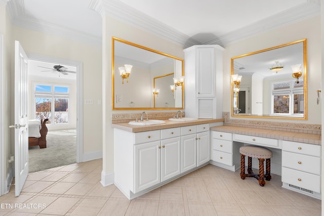 bathroom with ornamental molding, tile patterned flooring, and a sink