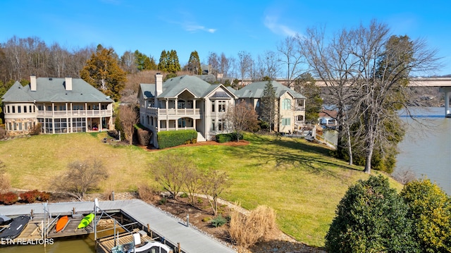 drone / aerial view with a residential view and a water view