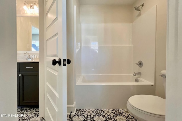 full bath with washtub / shower combination, tile patterned flooring, vanity, and toilet