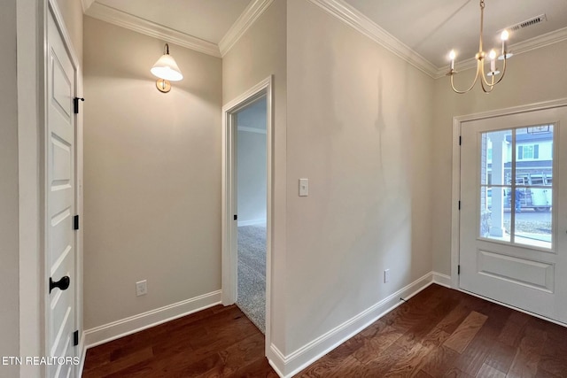 entryway with ornamental molding, dark wood-style flooring, visible vents, and baseboards