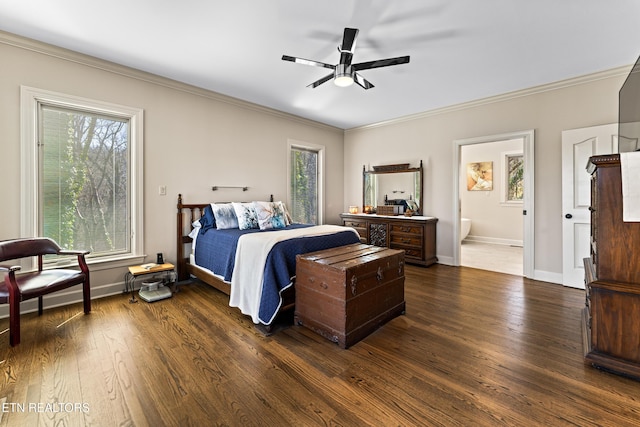 bedroom featuring crown molding, dark wood-type flooring, and baseboards