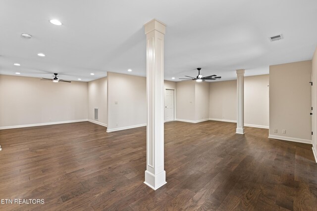 below grade area featuring visible vents, dark wood finished floors, and a ceiling fan