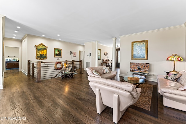 living area with recessed lighting, wood finished floors, crown molding, and ornate columns