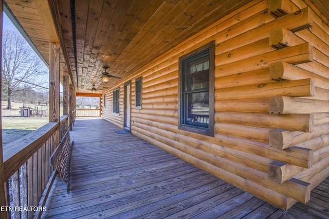 wooden terrace with a ceiling fan