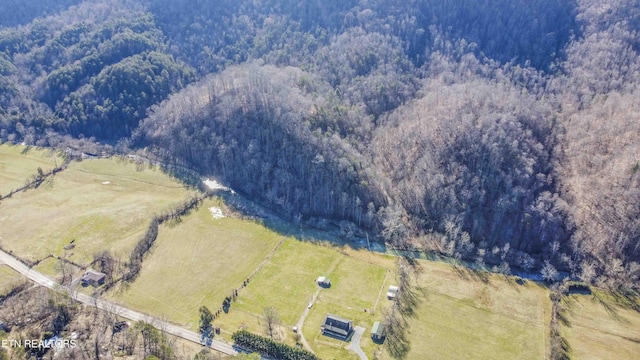 bird's eye view with a forest view and a rural view