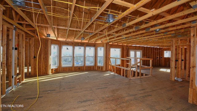 misc room with a wealth of natural light and an upstairs landing