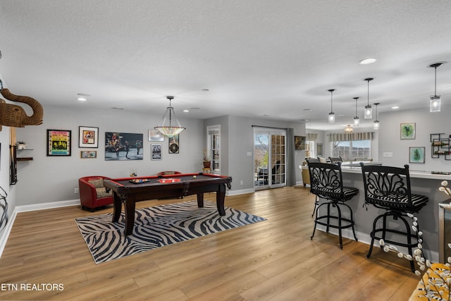 rec room featuring baseboards, recessed lighting, wood finished floors, a textured ceiling, and billiards