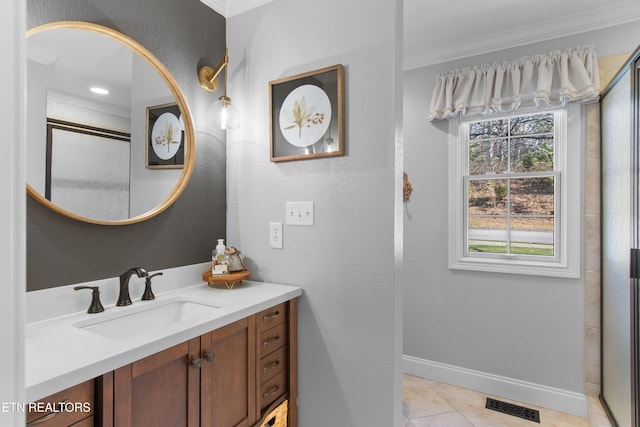 bathroom with visible vents, crown molding, tile patterned flooring, baseboards, and vanity