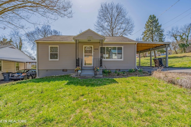 view of front facade with a front yard, driveway, entry steps, a carport, and crawl space