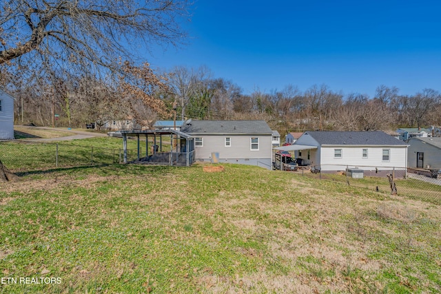 back of house with crawl space, a fenced backyard, and a yard