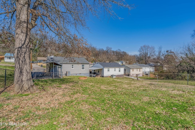 view of yard with cooling unit and a fenced backyard