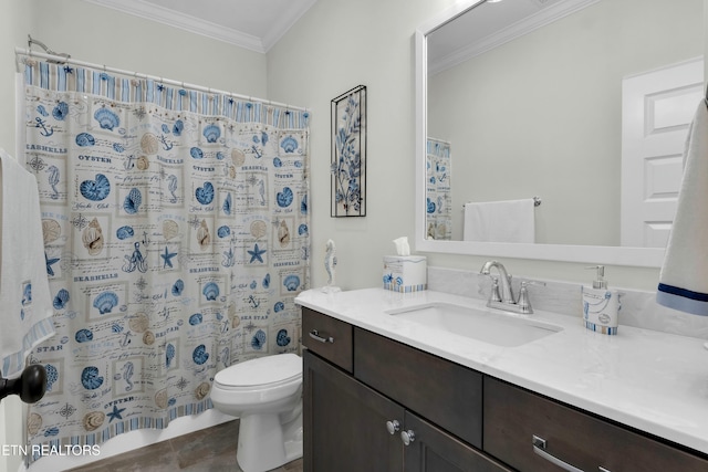 bathroom featuring ornamental molding, curtained shower, vanity, and toilet